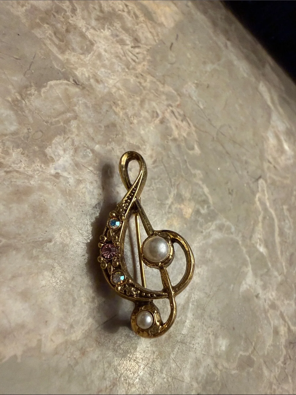 Vintage brand 1928 gold tone, music note brooch with rhinestones and faux pearls